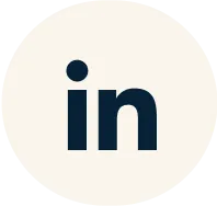 LinkedIn logo in dark blue on a light circular background.